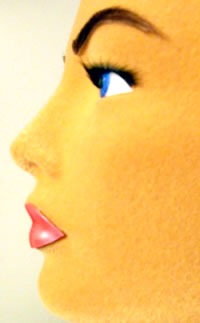 Side view of the Poly Star Lady face with clay eyes and lips