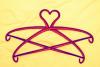 Image of two clothes hangers stacked to create a heart shape